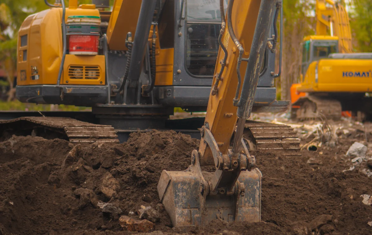 Excavator using a digging bucket during general soil excavation