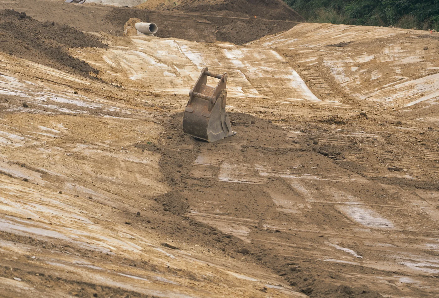 Earthmoving site prepared for soil processing and topsoil reuse