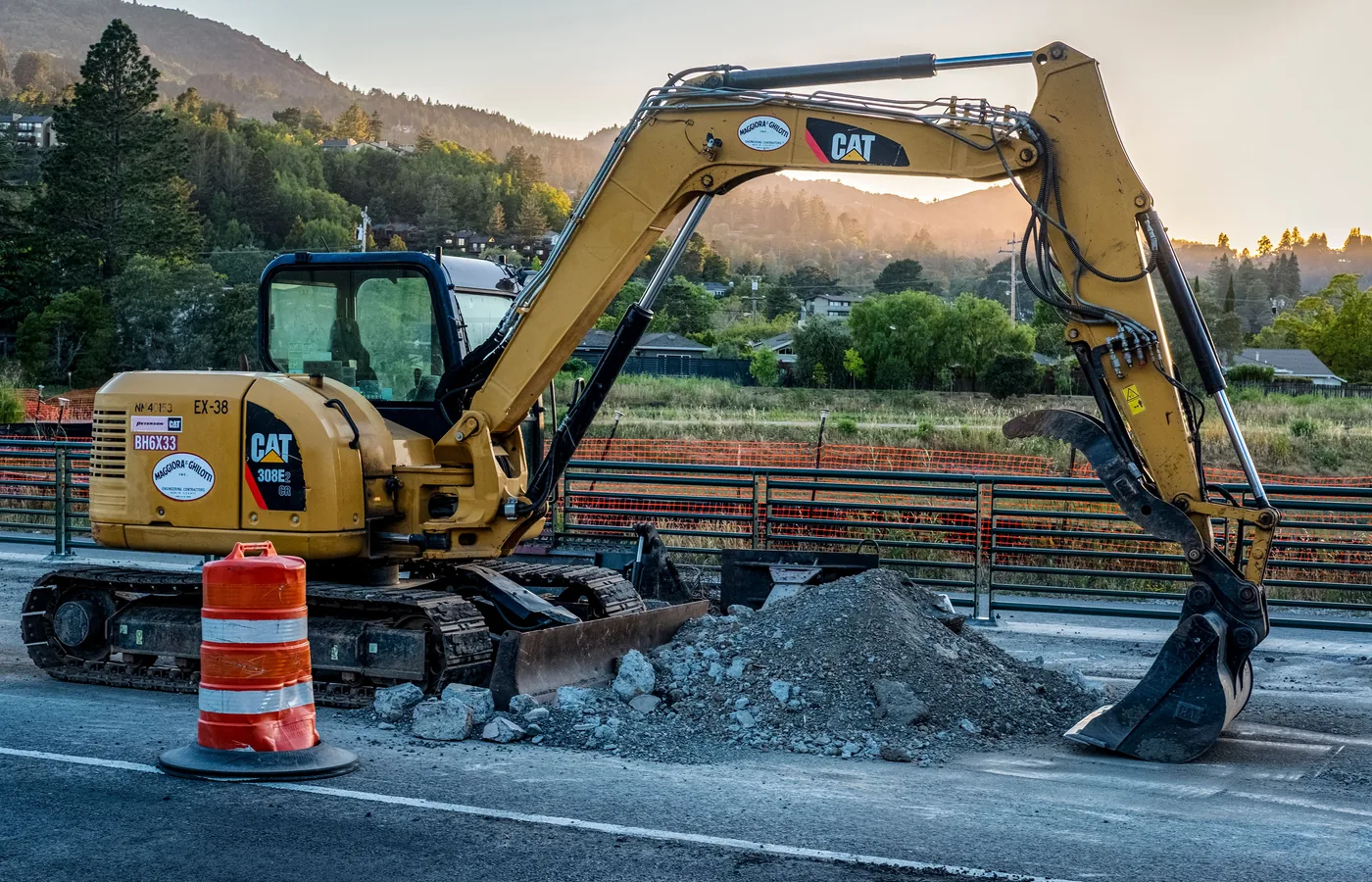 Excavator working on a controlled road construction site